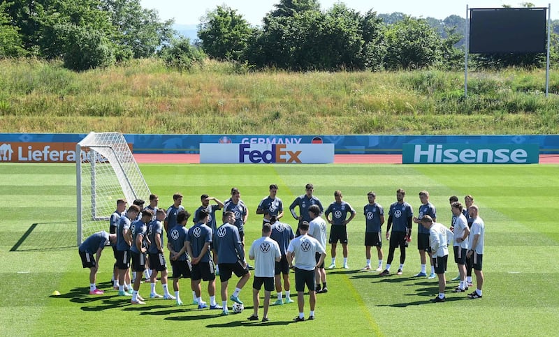 Joachim Low talks to the Germany squad during training. AFP