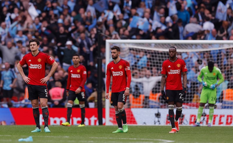 Dejected United players after Coventry's third goal.  Reuters 