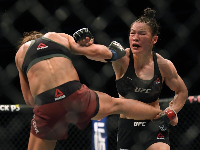 LAS VEGAS, NEVADA - MARCH 07:    Weili Zhang punches Joanna Jedrzejczyk in her split decision win during a strawweight title bout at T-Mobile Arena on March 07, 2020 in Las Vegas, Nevada. (Photo by Harry How/Getty Images)