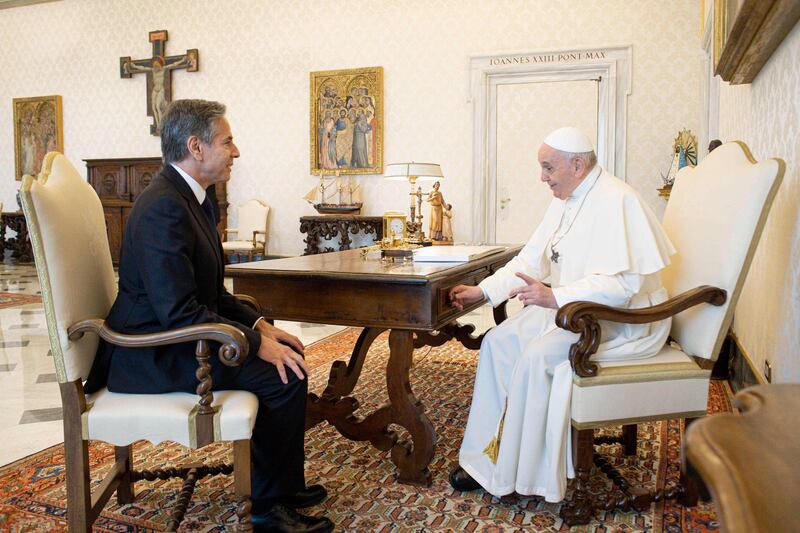 Pope Francis talks with Secretary of State Antony Blinken, as they meet at the Vatican. AP Photo