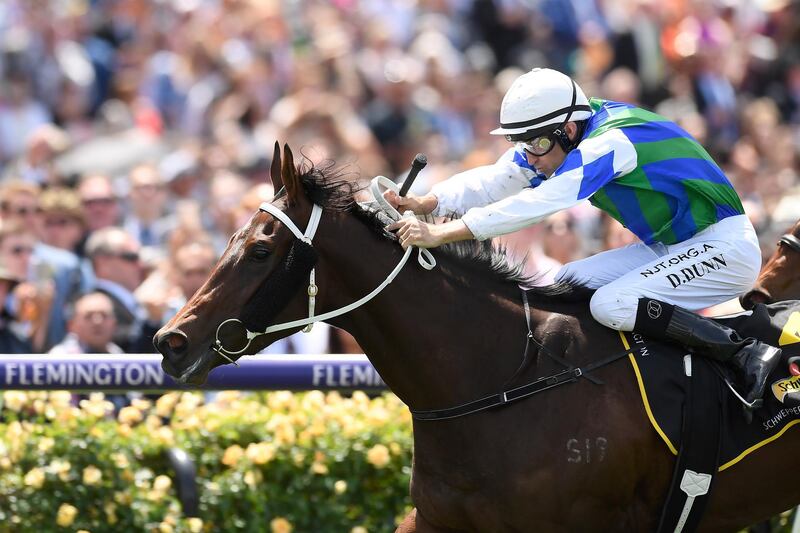 Dwayne Dunn rides Garner to victory in race five, the Schweppervescence Plate. EPA