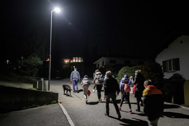Ukrainian refugees walk to their foster home in the village of Mumliswil after travelling from Krakow in a plane chartered by a Swiss millionaire. AFP