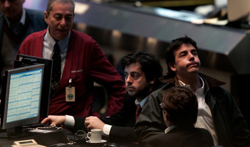Traders work on the floor of the Buenos Aires Stock Exchange in Buenos Aires August 10, 2007. Global stock markets, including those in Argentina, fell and high-yielding currencies lost value on Friday, even as central banks pumped extra cash into the financial system to help temper fears of a liquidity crisis gripping investors. REUTERS/Marcos Brindicci (ARGENTINA)