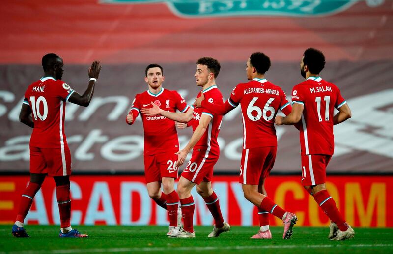 Diogo Jota, centre, celebrates with Liverpool teammates after scoring. AFP