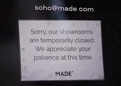 A sign in the window of the Made.com store in Charing cross Road. PA