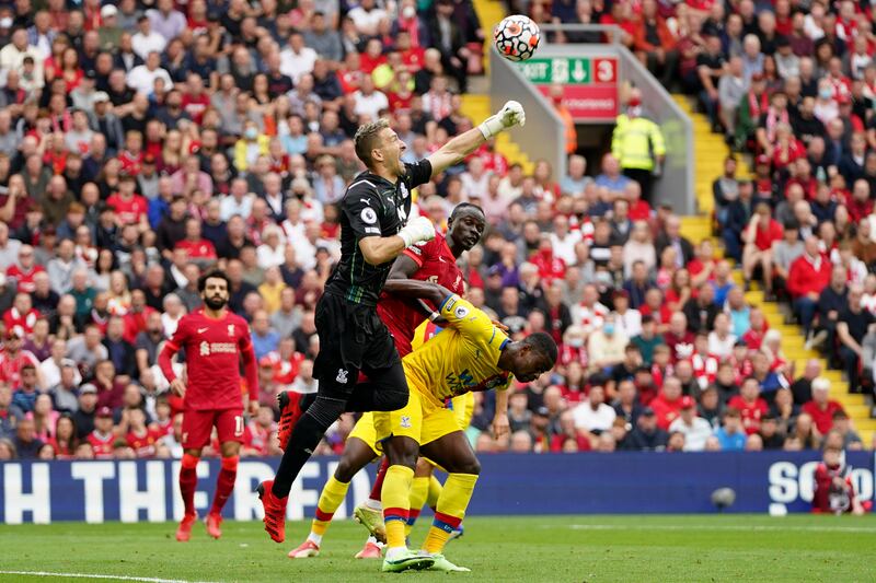 Crystal Palace goalkeeper Vicente Guaita jumps and punches the ball. AP