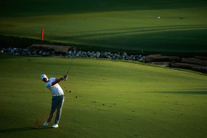 Danny Willett of England plays his approach shot into the 18th green during the third round. Warren Little / Getty Images