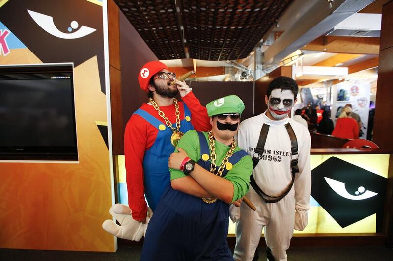 From left to right: Faisal Al Awadhi aka gangster Mario, Kamal Nazir aka gangster Luigi and Anonymous Joker are photographed at the Middle East Film and Comic Con in Dubai on April 5, 2013. Sarah Dea / The National