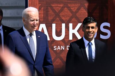 President Joe Biden, left, and British Prime Minister Rishi Sunak arrive at Naval Base Point Loma in San Diego, California, as they unveil the Aukus security pact. AP