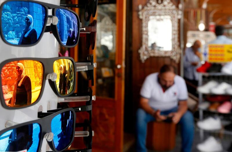 A Syrian shopkeeper waits for customers in a bazaar in old Damascus. AFP