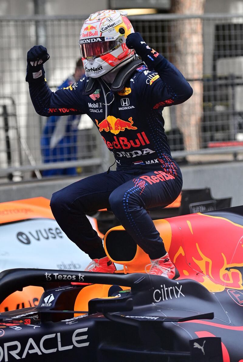 Red Bull's Max Verstappen celebrates as he gets out of his car after winning the Monaco Grand Prix on Sunday. AFP