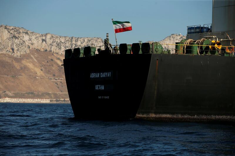 REFILE - CORRECTING GRAMMAR The Iranian flag flies on board the Iranian oil tanker Adrian Darya 1, formerly named Grace 1, as it sits anchored after the Supreme Court of the British territory lifted its detention order, in the Strait of Gibraltar, Spain, August 18, 2019. REUTERS/Jon Nazca