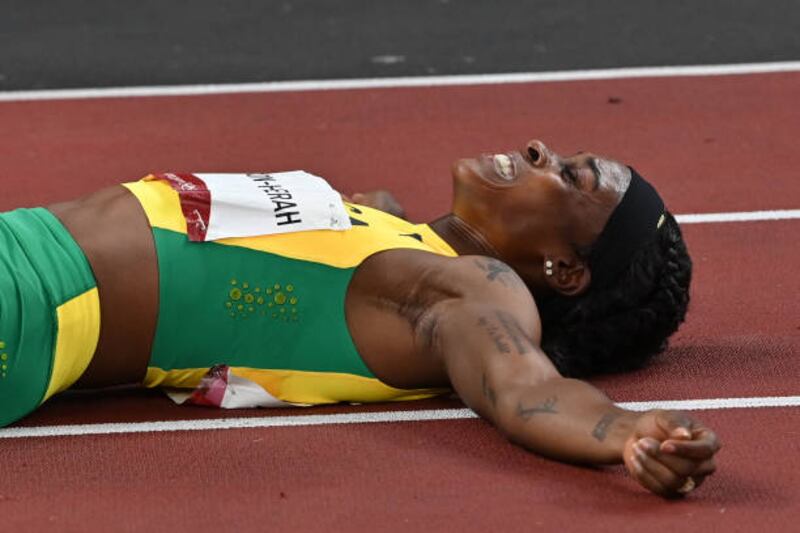 Jamaica's Elaine Thompson-Herah celebrates after wining the women's 200m final.