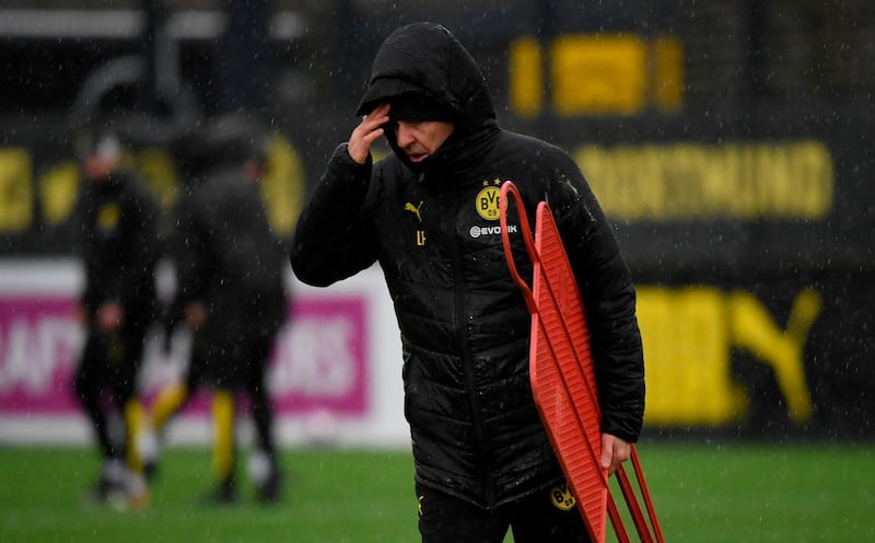 Dortmund's Swiss coach Lucien Favre is pictured during a training session on the eve of the UEFA Champions League round of 16 first leg match against PSG. AFP