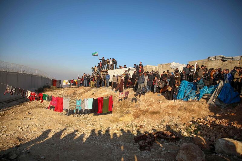 Syrians gather during a symbolic protest in the city of Harem in the rebel-held northern countryside of Syria's Idlib on the border with Turkey.  AFP