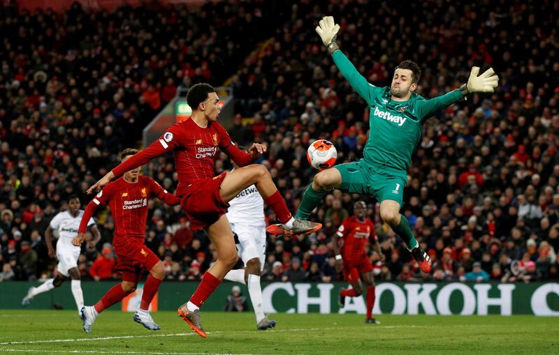 Liverpool's Trent Alexander-Arnold in action with West Ham United's Lukasz Fabianski before Sadio Mane scores. Reuters