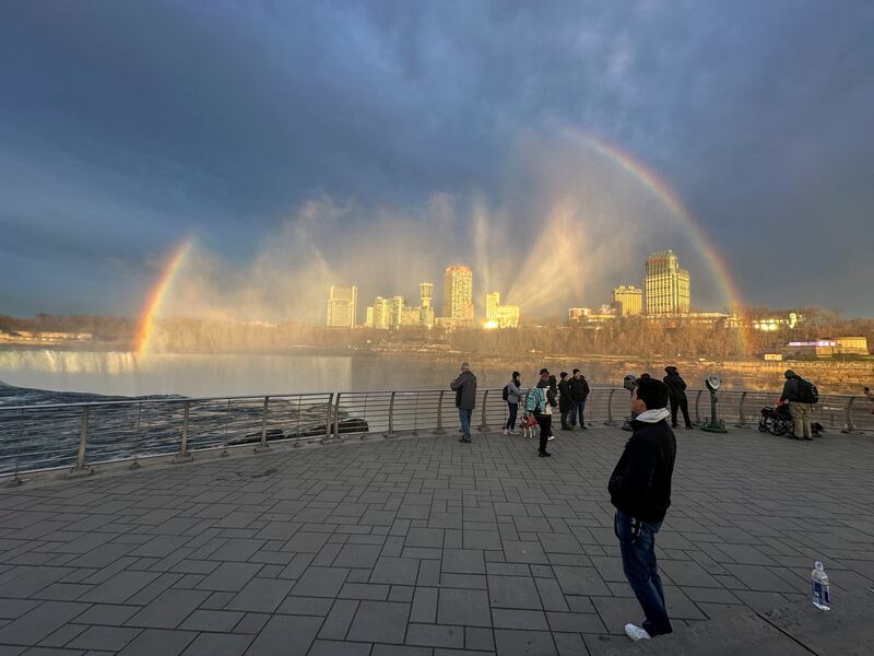 A rainbow forms over Niagara Falls as people wait for the solar eclipse. Reuters