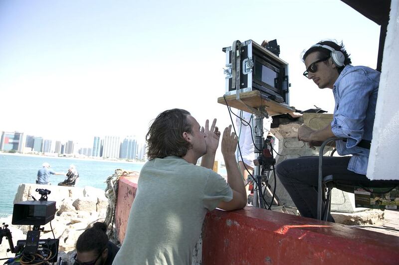 Ali Mostafa, right, with director of photography Michel Dierickx while shooting From A to B in Abu Dhabi. Silvia Razgova / The National