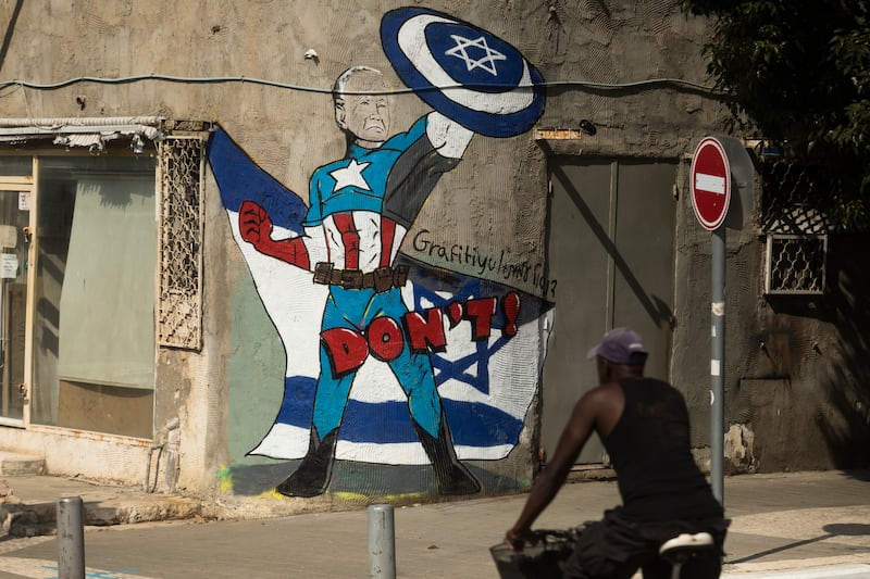 Street art showing US President Joe Biden as Captain America, the super hero, in southern Tel Aviv on Wednesday. Getty Images