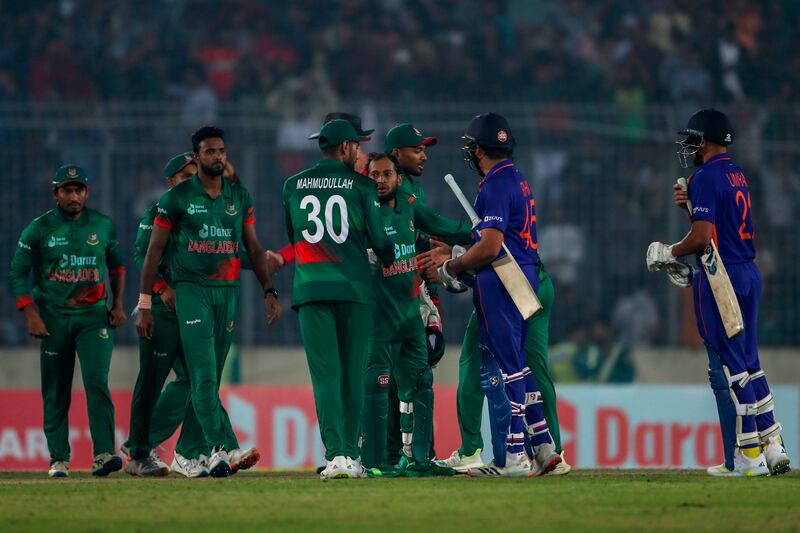 Indian captain Rohit Sharma, second right, congratulates Bangladesh players. AP