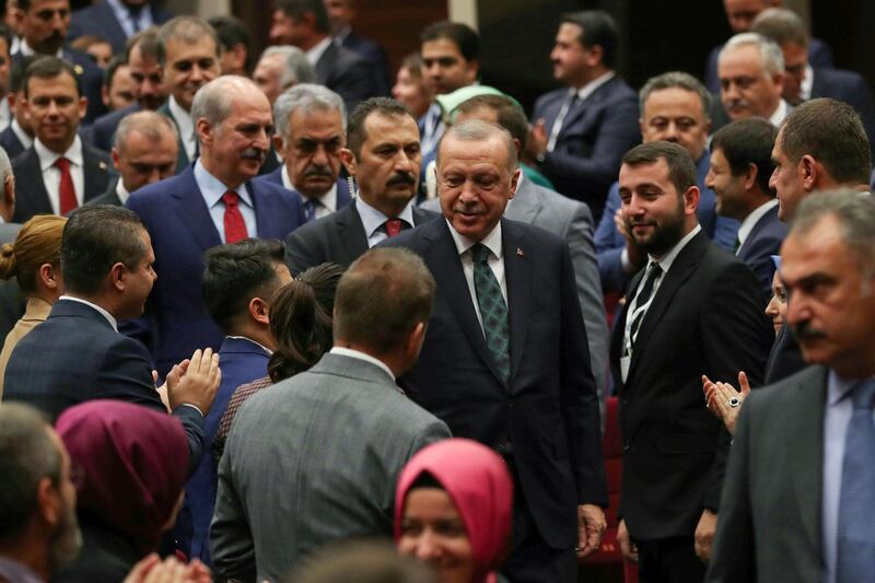 Turkish President Recep Tayyip Erdogan (C) attends the extended meeting with provincial heads of ruling Justice and Development (AK) Party in Ankara, Turkey, on October 10, 2019.   / AFP / Adem ALTAN
