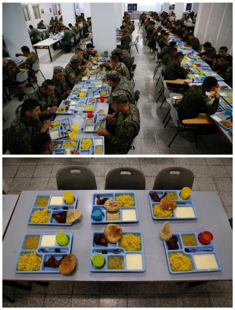 Members of the Palestinian National Security Forces having iftar in the dining hall at a base in the West Bank of Jericho June 14, 2016. Photo by Ammar Awad
