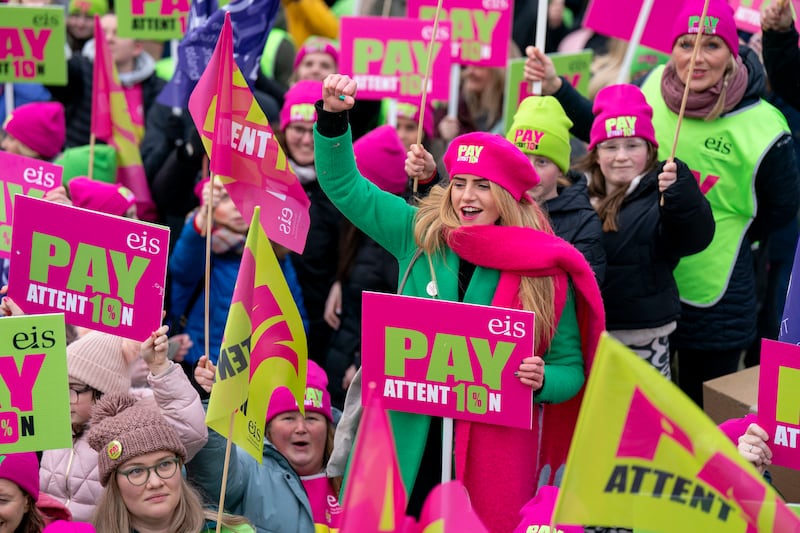 Members of the Educational Institute of Scotland join teachers at a rally outside the Scottish Parliament, in Edinburgh. AP