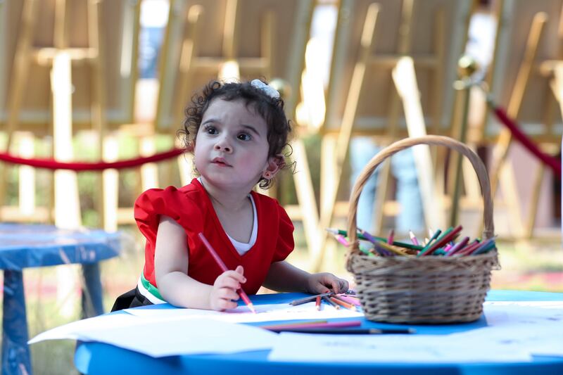 Marsa Mansour, 2, wearing her National Day dress at the Heritage Village in Abu Dhabi. Khushnum Bhandari / The National