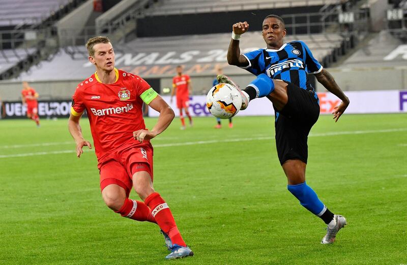 Inter Milan's Ashley Young, right, under pressure from Lars Bender of Leverkusen. PA