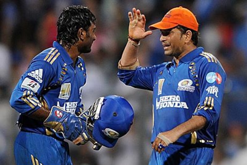 Sachin Tendulkar, right, and Ambati Rayudu celebrate Mumbai's victory against Kings XI Punjab.