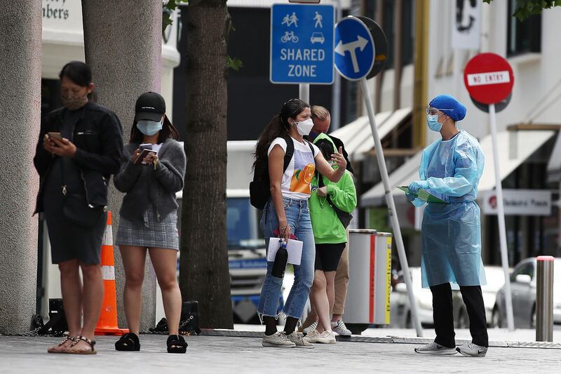 Nurses speak to people waiting in line outside a pop up Covid-19 testing station in Freyberg Place on High St in Auckland, New Zealand. Getty Images