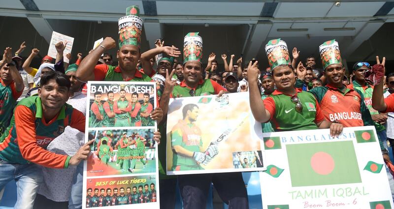 Bangladeshi cricket fans cheer in support of their national team during the one day international (ODI) Asia Cup cricket match between Bangladesh and Sri Lanka at the Dubai International Cricket Stadium in Dubai on September 15, 2018. / AFP / ISHARA S. KODIKARA
