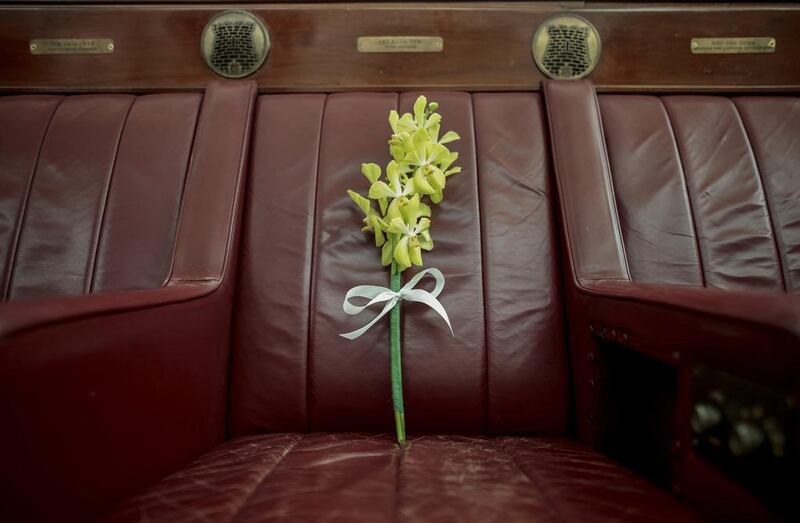 A stalk of orchids placed on the seat of Singapore’s first Prime Minister Lee Kuan Yew at the Arts House, the former Parliament House, in Singapore, Singapore. The country’s first prime minister, Lee Kuan Yew, passed away last year on March 23 at the age of 91. Wallace Woon / EPA