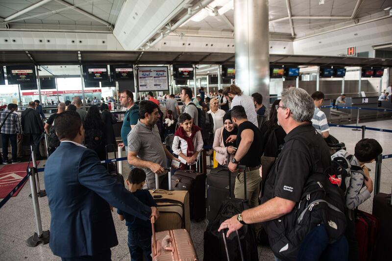 Passengers flying to Arbil wait to check-in for their flight at Ataturk International airport in Istanbul on September 28, 2017.
All foreign flights to and from the Iraqi Kurdish regional capital Arbil will be suspended from the evening of September 29 on Baghdad's orders, its airport director said, following a controversial independence referendum. / AFP PHOTO / YASIN AKGUL