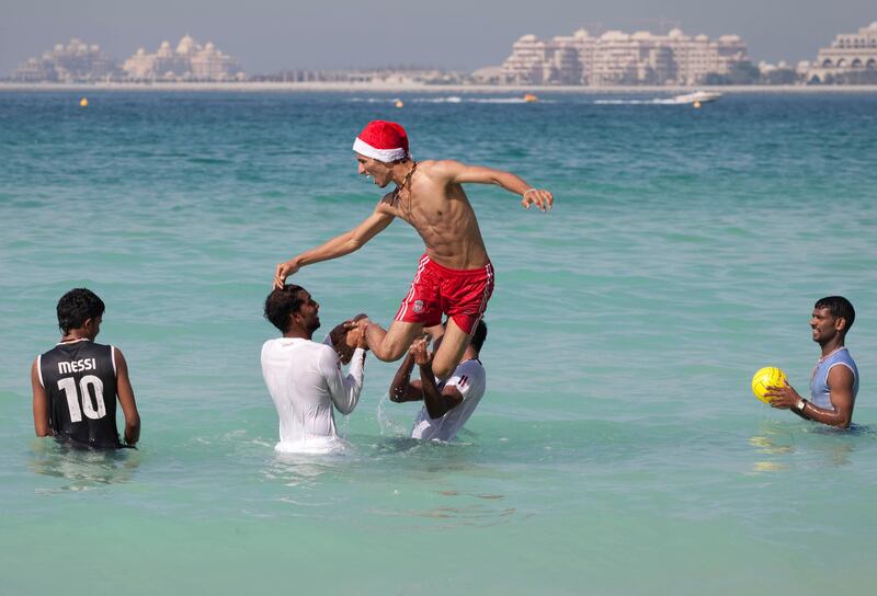 Dubai, United Arab Emirates - December 25 2012 - Residents and tourists flocked to the JBR Beach on Christmas day to enjoy the sunshine and good weather. (Razan Alzayani / The National) 