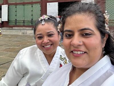 Taking a trip to South Korea post-divorce with my supportive sister, right, helped take my mind off things back home, and kick-started the healing process. Aarti Jhurani / The National