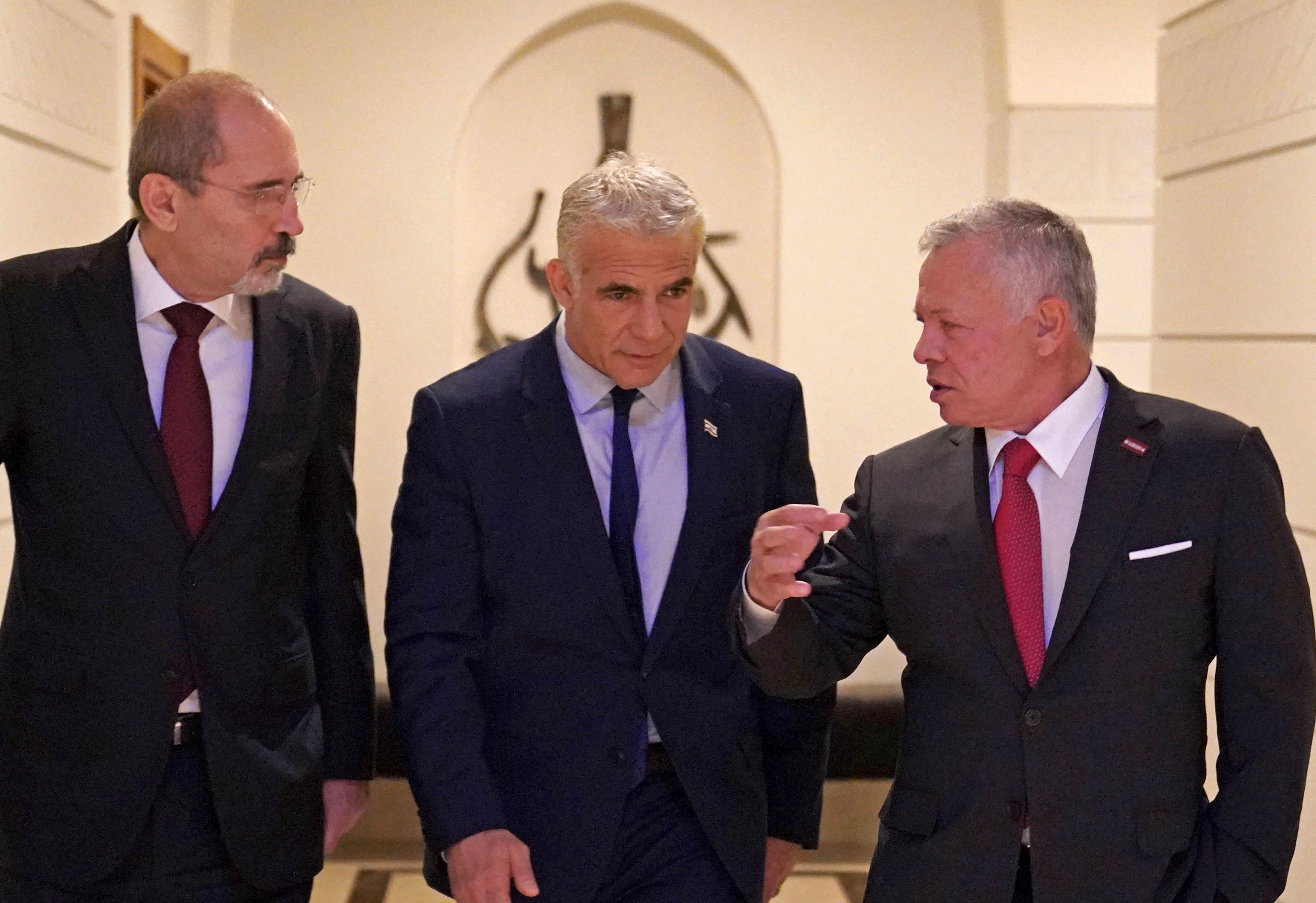 King Abdullah, right, accompanied by Jordan's Foreign Minister Ayman Safadi, left, receives current Israeli Prime Minister Yair Lapid in Amman.  AFP