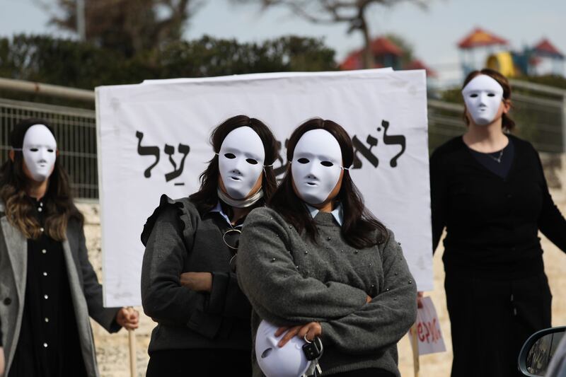 Ultra-Orthodox Jewish women wear masks during a rally to denounce sexual harassment in the Haredi community in Israel, in the ultra-Orthodox district of Ramat Shlomo near Jerusalem.  EPA
