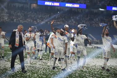 MADRID, SPAIN - MAY 29:  Real Madrid manager Carlo Ancelotti walks with his team during celebrations at estadio Santiago Bernabeu after winning the UEFA Champions League Final  on May 29, 2022 in Madrid, Spain. (Photo by Denis Doyle / Getty Images)