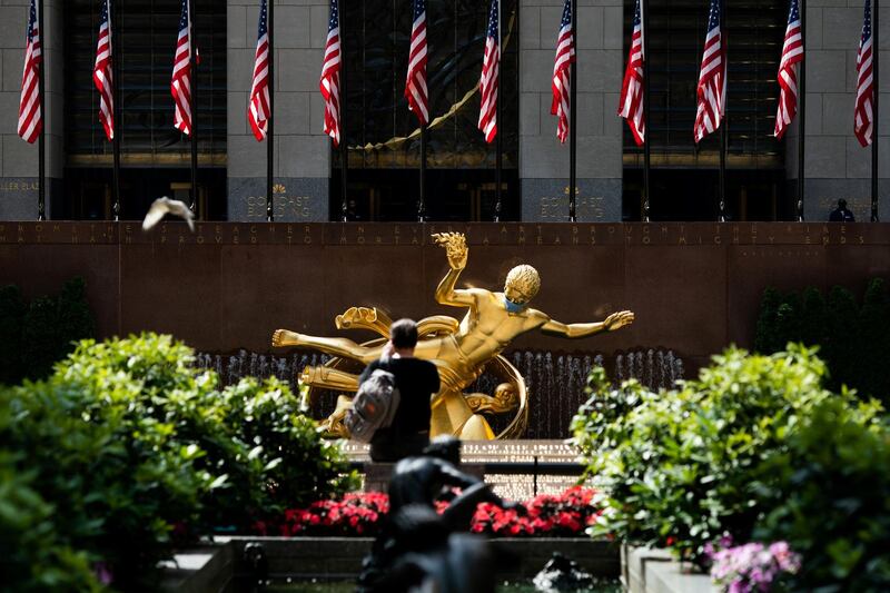 The Prometheus statue at Rockefeller Centre in Manhattan, New York City, is seen adorned with a face mask. Reuters