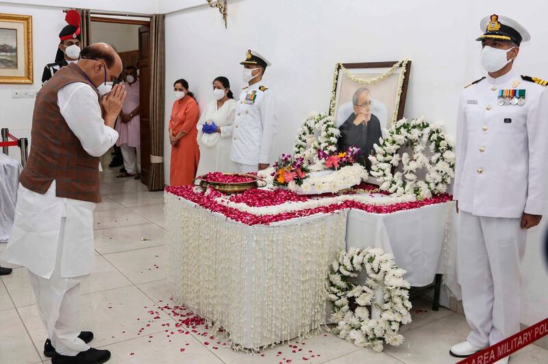 India's Defence Minister Rajnath Singh pays tributes to Mukherjee. AFP