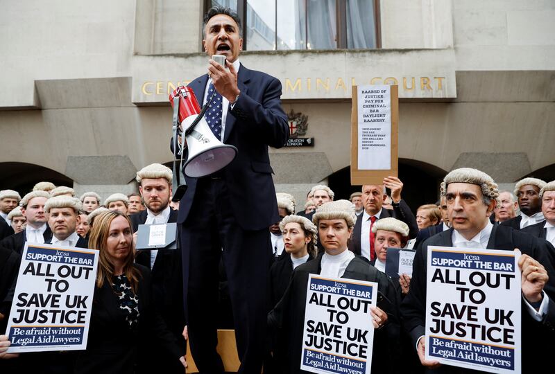 Jo Sidhu, chairman of the Criminal Bar Association, speaks during a strike by criminal barristers outside the Old Bailey in London. Reuters