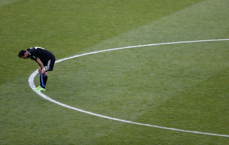 Argentina's Lionel Messi reacts following his teams 1-1 draw. Rebecca Blackwell / AP Photo