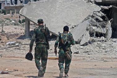 Syrian government forces gather near Khan Shaykhun in Idlib province. AFP