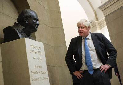 Boris Johnson looks at a bust of Winston Churchill as he departs the US Capitol after a visit with Congressional leadership on September 22, 2021 in Washington, DC. Getty Images / AFP
