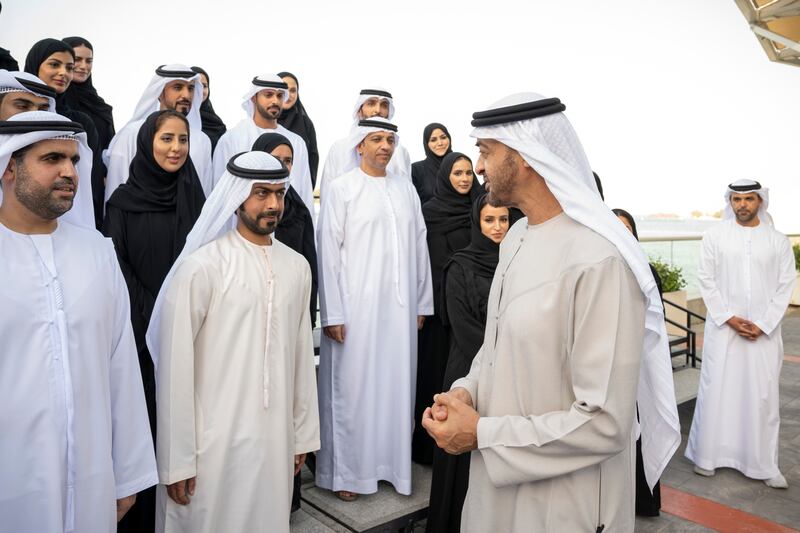 The President, Sheikh Mohamed, speaks with Sheikh Khalifa bin Tahnoon, director of the Martyrs' Families' Affairs Office of the Abu Dhabi Crown Prince Court, and a delegation from the office during a Sea Palace barza in Abu Dhabi. All photos: Ministry of Presidential Affairs