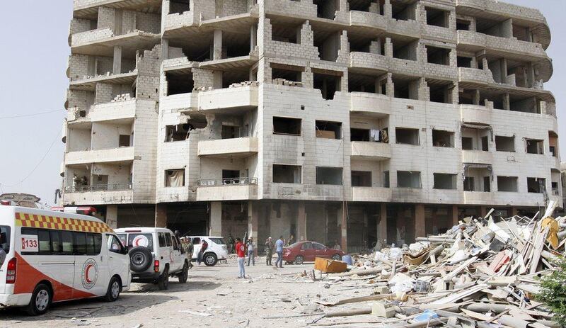 Dozens of buses, eight ambulances and several Red Crescent and UN vehicles were lined up at the entrance of Daraya on the morning of August 26, 2016, waiting for the green light. AP Photo