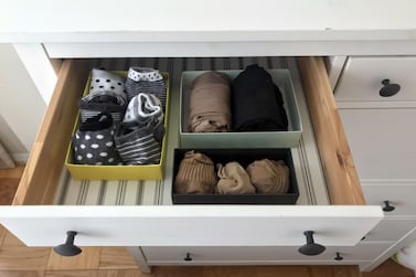 Socks and tights are seen arranged in a drawer in small boxes as recommended by Japanese tidying expert Marie Kondo. AFP