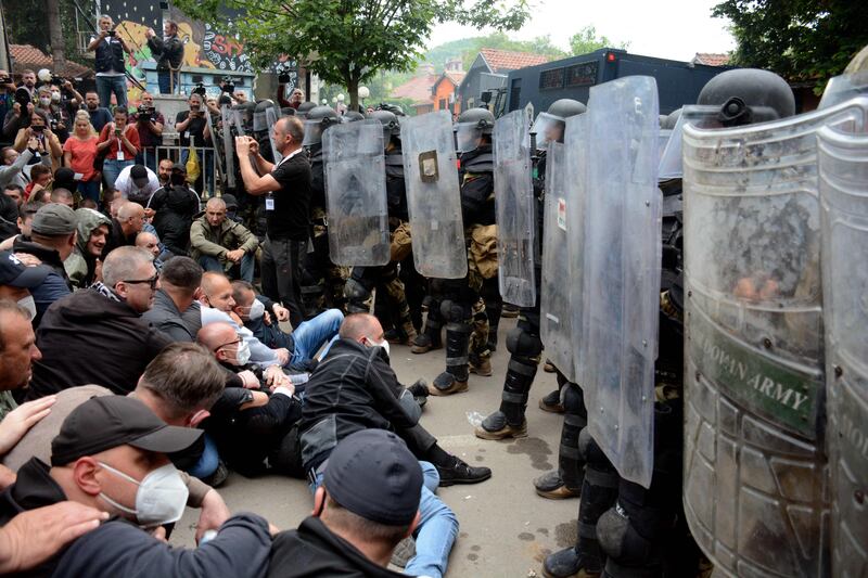 Riot police face Serbs in Kosovo who are demanding the removal of recently elected Albanian mayors outside municipal building in Zvecan, northern Kosovo. AFP