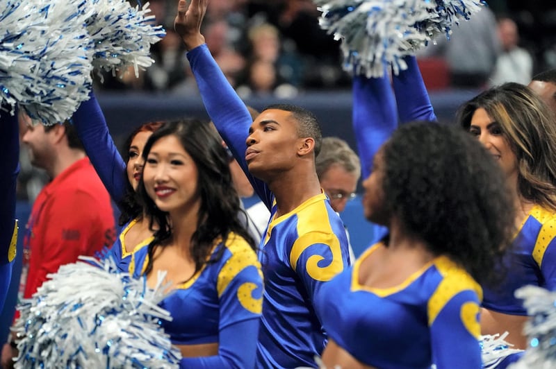 Rams cheerleader Napoleon Jinnies (C) performs with other cheerleaders during Super Bowl LIII between the New England Patriots and the Los Angeles Rams at Mercedes-Benz Stadium in Atlanta, Georgia, on February 3, 2019. (Photo by TIMOTHY A. CLARY / AFP)